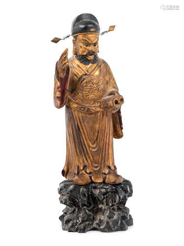 A Chinese Gilt Decorated Wood Figure of a Standing