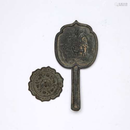 Two archaic bronzes Chinese comprising of a hand mirror engr...