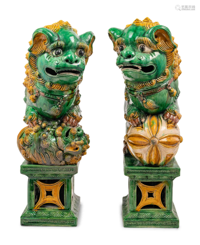 A Pair of Chinese Sancai Glazed Porcelain Figures of Fu