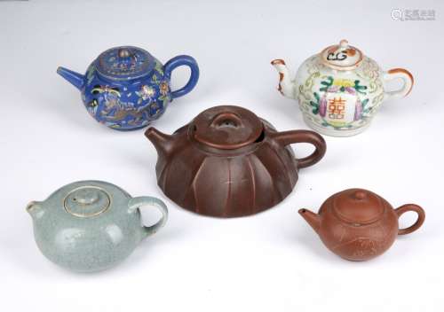 Group of five teapots Chinese to include two Yixing examples...