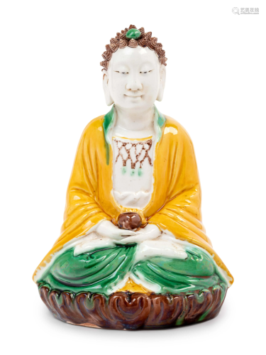 A Chinese Sancai Glazed Biscuit Figure of Buddha