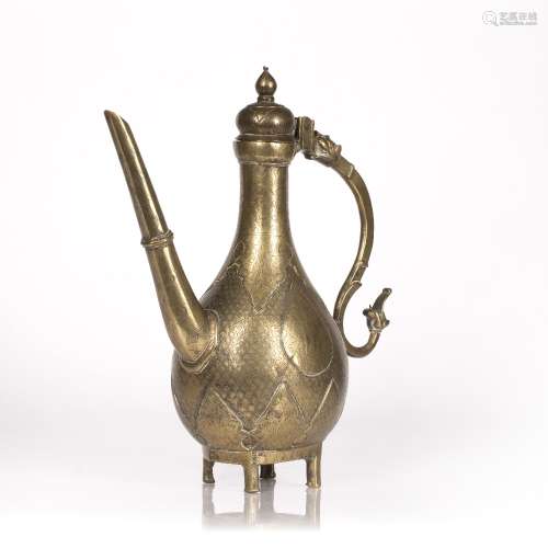 Mughal brass ewer Indian, 18th Century with a straight spout...