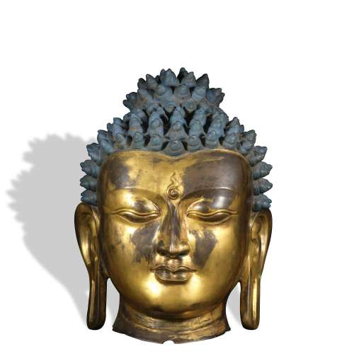 A gilt-bronze buddha head