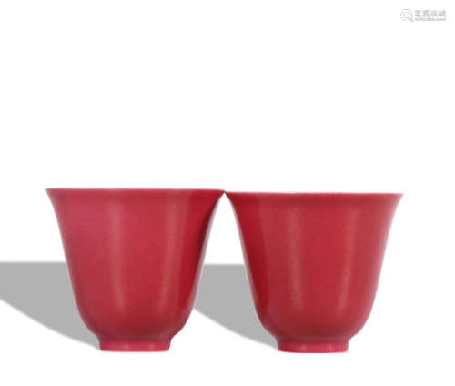 A pair of red glazed cup