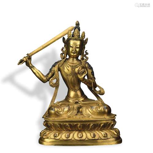 A gilt-bronze figure of Manjusri