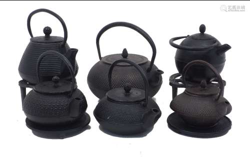 Six Japanese cast iron kettles, 20th Century, each of squat ...