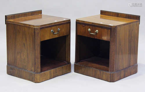 A set of three Art Deco walnut bedside cabinets, each fitted...