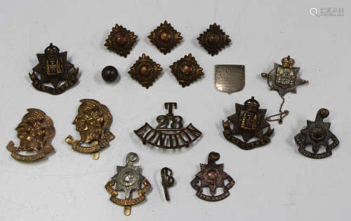 A small group of military insignia, including cap and collar...