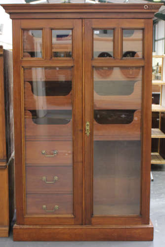 A pair of late Victorian mahogany gentleman's wardrobes, the...