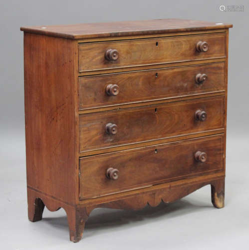A George IV mahogany chest of four oak-lined drawers with bo...