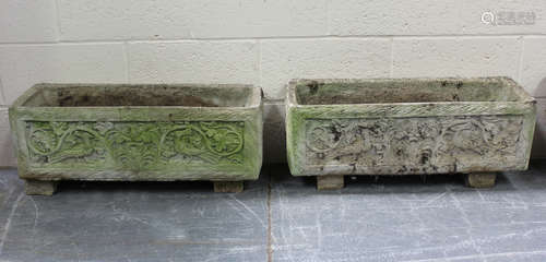 A pair of 20th century cast composition stone rectangular ga...