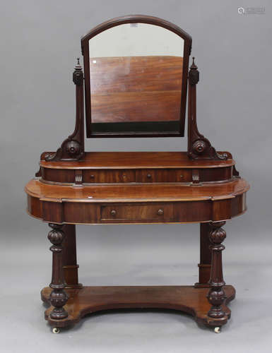 A late Victorian mahogany Duchess dressing table, the swing ...