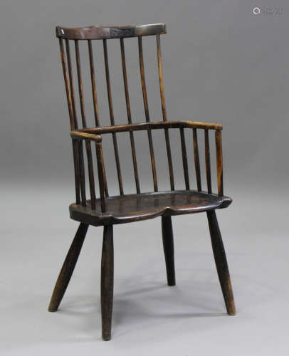 A 19th century primitive ash and elm Windsor armchair, the h...