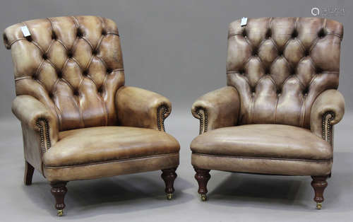 A pair of modern buttoned brown leather armchairs by Fleming...