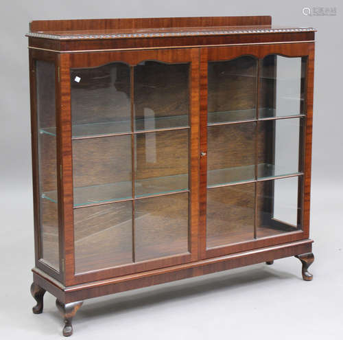 A George V mahogany display cabinet, on cabriole legs, heigh...