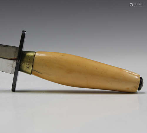 An unusual Tom Beasley style fighting knife, the blade etche...