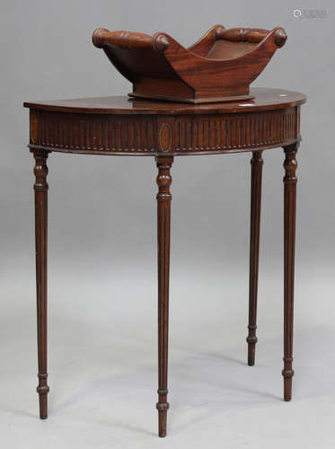 A 20th century reproduction mahogany demi-lune table, height...