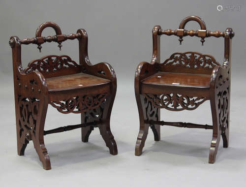 A pair of late 19th century mahogany fretwork window seats, ...