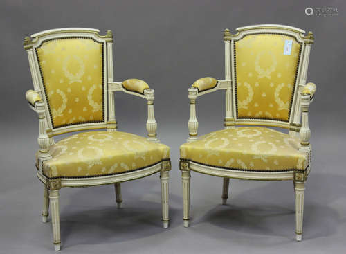 A pair of 20th century Louis XVI style white painted and gil...