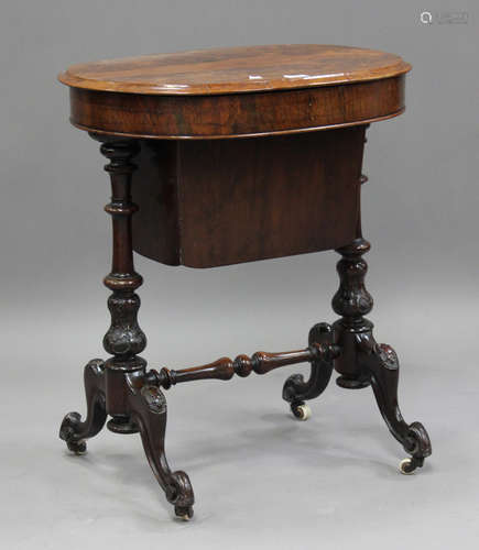 A late Victorian rosewood work table, the hinged top above a...