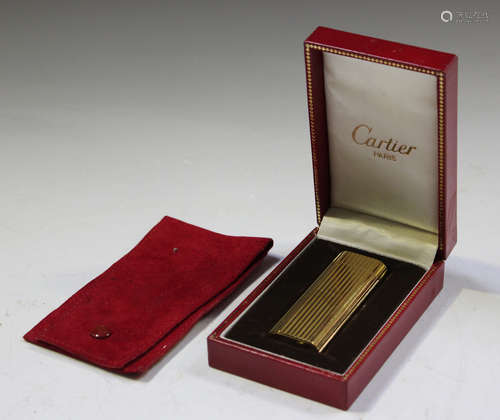 A Cartier gold plated pocket lighter, serial number 'N53118'...