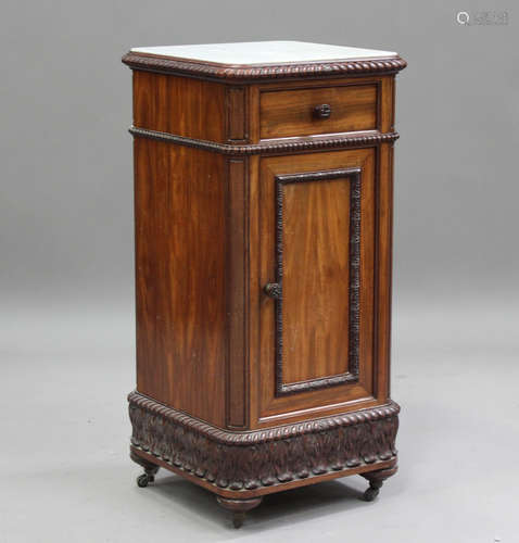 A late 19th century French mahogany bedside cabinet, the whi...