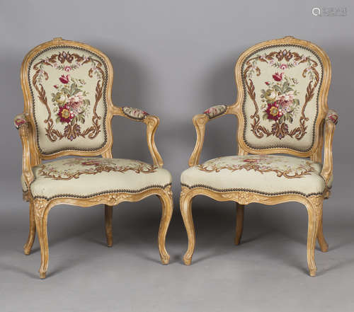 A pair of 18th century French Rococo walnut showframe fauteu...