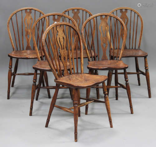 A set of six late 19th century ash and elm Windsor kitchen c...