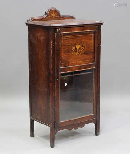 A late Victorian walnut music cabinet with inlaid decoration...