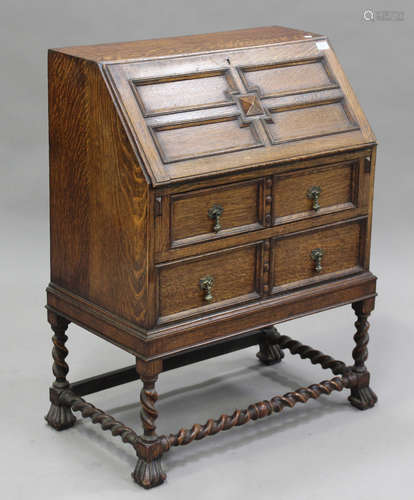 A George V oak bureau, the fall-front above two drawers, hei...