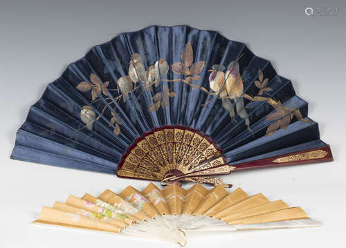 A late 19th century mother-of-pearl and silk folding fan, pa...