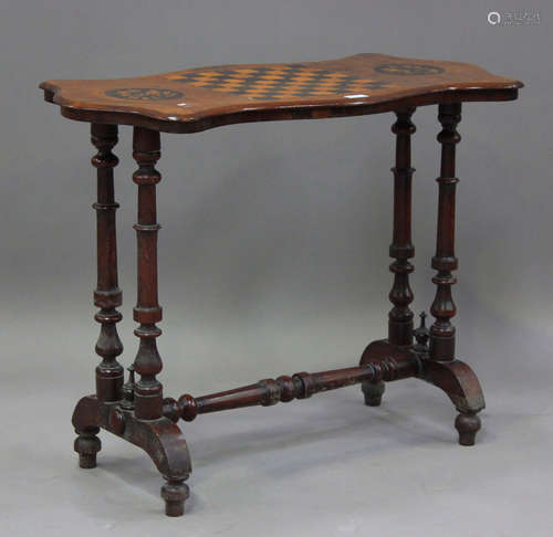 A mid-Victorian walnut stretcher table, the top with inlaid ...