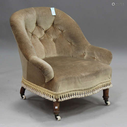 A late Victorian walnut tub back armchair, raised on china c...