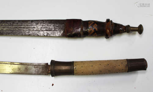 An early 20th century African Mandigo sword, blade length 76...