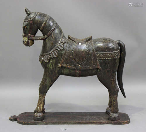 A large Indian carved and painted hardwood model of a horse ...