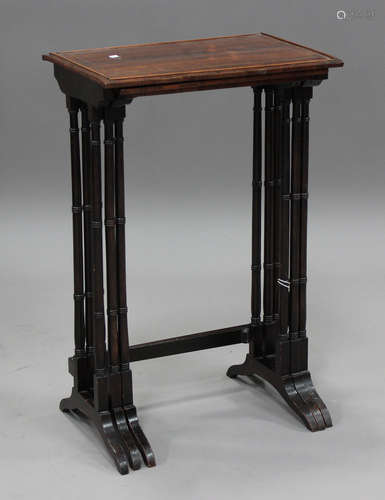 A Regency rosewood nest of three occasional tables with bras...