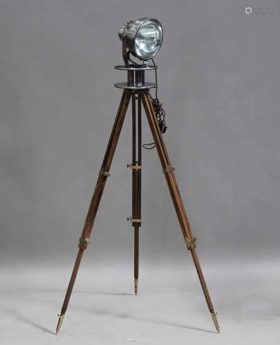 A mid-20th century patinated tin studio floor lamp, one side...