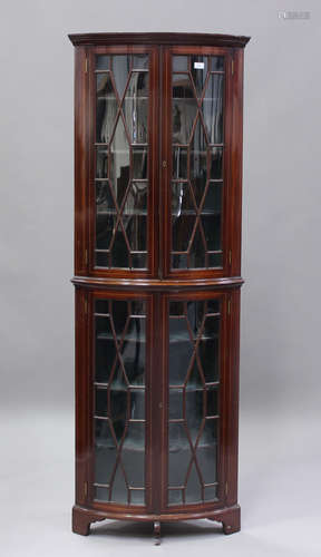 An Edwardian mahogany bowfront floor-standing display cabine...