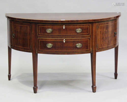 A late George III mahogany demi-lune side cabinet with chequ...