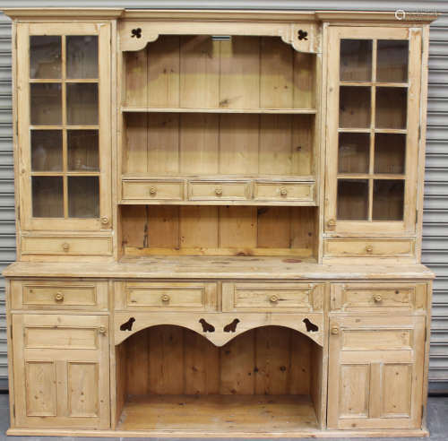 A late 20th century pine kitchen dresser, the shelf back wit...