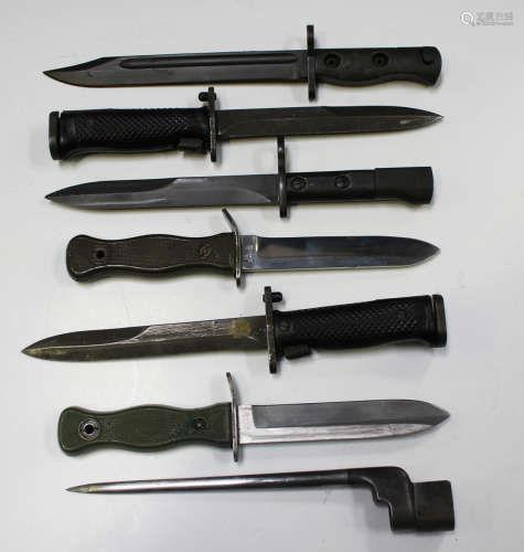 A small group of mid-20th century bayonets, including two US...