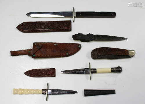 A small collection of various small-bladed knives, including...