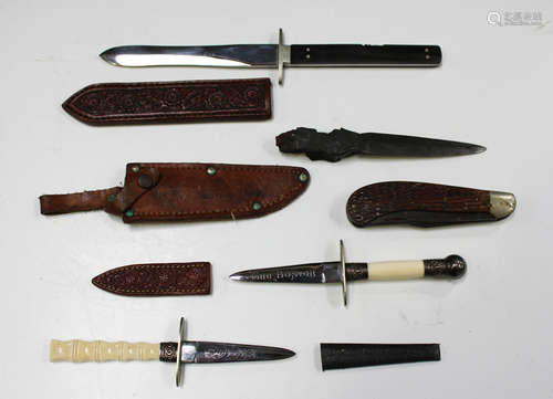 A small collection of various small-bladed knives, including...