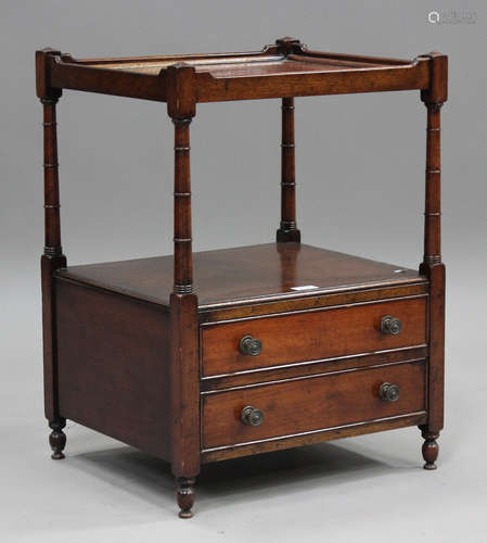 A 20th century George III style mahogany two-tier whatnot, f...