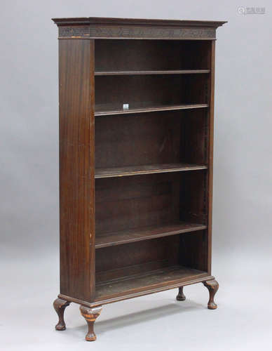 An early 20th century mahogany open bookcase, the frieze wit...