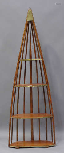 A late 20th century walnut and brass mounted four-tier floor...