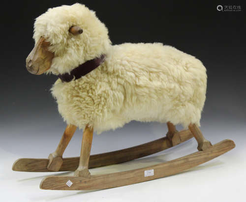 A 20th century pine framed and wool child's rocking sheep, h...