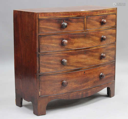 A George IV mahogany bowfront chest of oak-lined drawers wit...