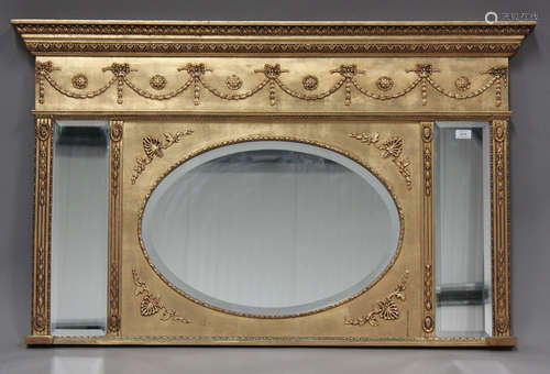 A modern Regency style gilt overmantel mirror, moulded with ...