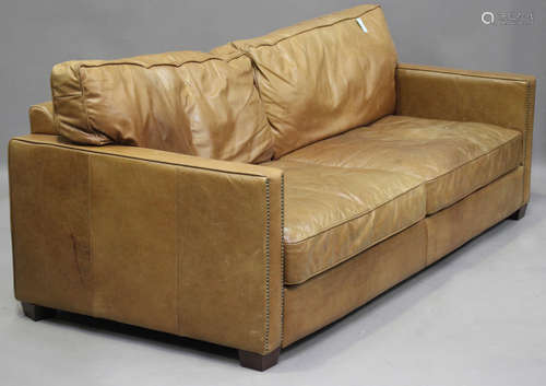 A modern brown leather two-seat sofa, height 72cm, length 22...